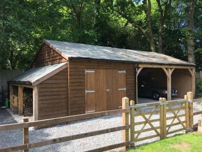 Pic 82. 6.0m x 5.4m 2 bay Carriage House, 3.6m x 5.4m Garage & 1.2m x 5.2m Log Store with felt roof